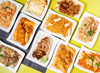 Assorted Stir-fried Instant Noodles with pork, beef, shrimp, Korean Cheese Fried Chicken, Braised Rice with Pork and Soy Sauce, pilaf and polao served in bowl isolated on table top view of taiwan food