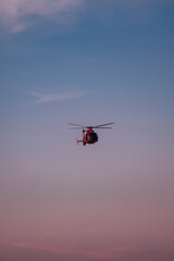Fototapeta na wymiar helicopter in the sky sky sunset