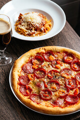 pepperoni pizza on a plate in a restaurant on the table