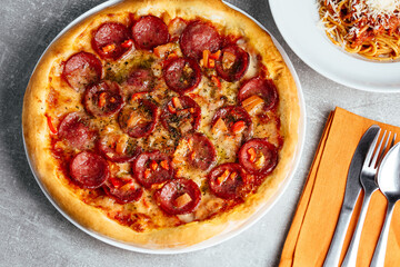 pepperoni pizza on a plate in a restaurant on the table