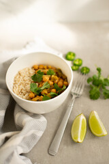 Chickpea Curry with Rice, Cilantro Garnish, Lime and Jalapeño Slices