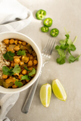 Chickpea Curry with Rice, Cilantro Garnish, Lime and Jalapeño Slices