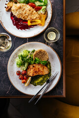 grilled fish with side dish, vegetables and herbs