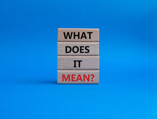 What does it mean symbol. Wooden blocks with words What does it mean. Beautiful blue background. Business and What does it mean concept. Copy space.