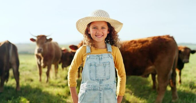 Nature, summer and girl in field with cows, happy dairy farmer on grass. Sustainability, farming and freedom, child with smile at green outdoor animal farm, happiness and grazing livestock in summer.