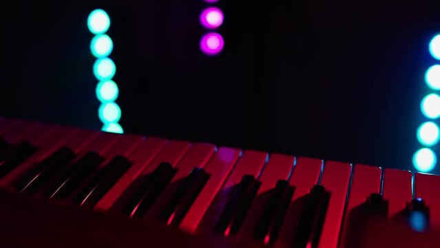 synthesizer piano, close up, colored lights