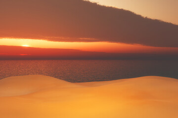 Fototapeta na wymiar 3D beach landscape against a sunset sky