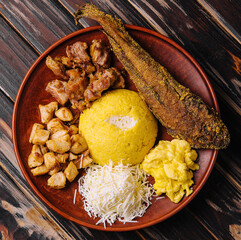 Traditional Moldavian hominy porridge on a wooden tray