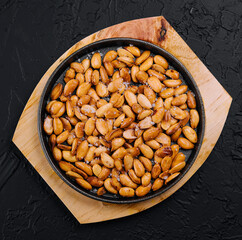 Organic roasted salty peanuts in a pan