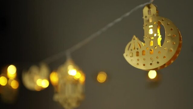 ramadan kareem iftar, month of fasting (saum), pillars of Islam, a garland of lantern figures lights up