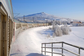 Obraz premium Polar Express in Kiruna in winter scenery. Kiruna is city with iron ore mine. Sweden, Arctic Circle, Swedish Lapland
