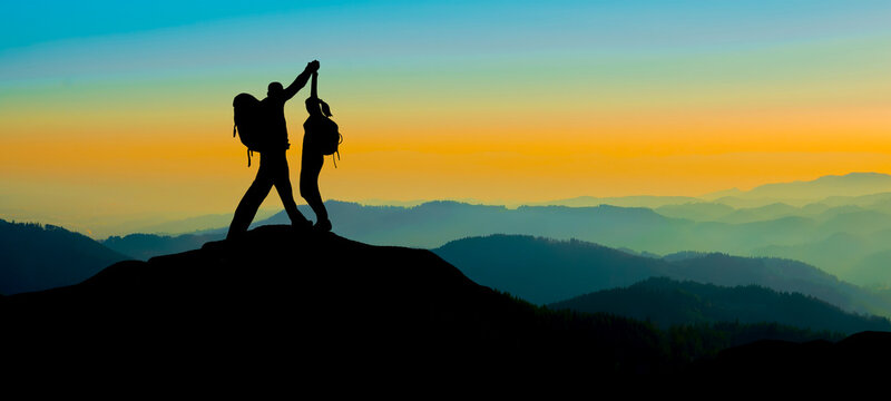Silhouette of hikers couple mountains forest woods in the morning, landscape panorama, hiking adventure travel sucess background