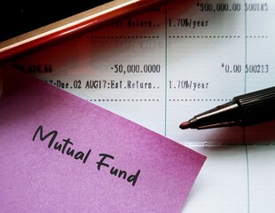 Bank passbook update with note written MUTUAL FUND - concept of personal finance investment vehicle...