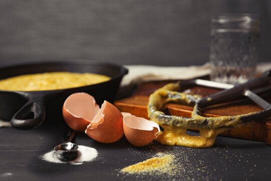 Close-up of messy kitchen counter with broken eggshells