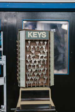 Close-up of keys hanging on hooks at auto repair shop