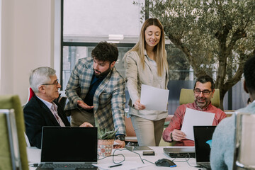 Four business people talking