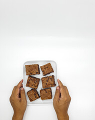 Delicious homemade brownies on white background 