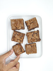 Delicious homemade brownies on white background 