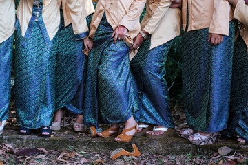 four Malay bridemaids show some leg and high heel shoes