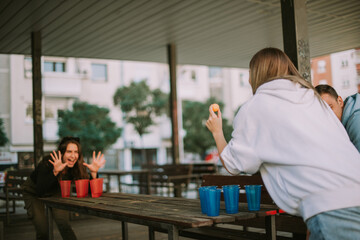 Playing beer pong at the bench