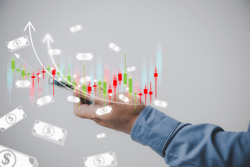Business, financial, investment of stock concept. A hand man holding a smartphone with a virtual growth chart to analysis planning strategy marketing for invest of stocks for profit to corporate.