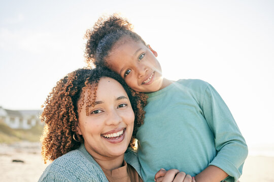 Happy mother, girl portrait and sea holiday with a smile on mothers day with love. Outdoor, beach and vacation break of a mom and child together with parent love and care in the sun with a hug