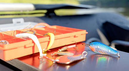 a box with fishing lures in a fisherman's boat