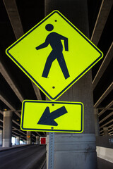 Yellow sign indiciating where person need to walk