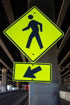 Yellow sign indiciating where person need to walk