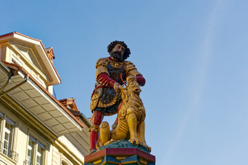 Samson sculpture with roman armor and lion on top of fountain at the old town of Bern, Switzerland....