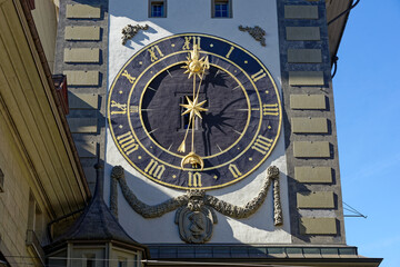 Clock tower with clock face named Zytglogge at the old town of Bern on a sunny winter day. Photo...