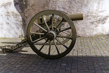 City of Thun with close-up of courtyard with cannon of white castle on a hill on a sunny winter day. Photo taken February 21st, 2023, Thun, Switzerland.