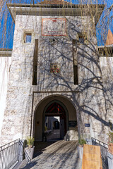 Old town of City of Thun with entrance gate of castle on a sunny winter day. Photo taken February 21st, 2023, Thun, Switzerland.