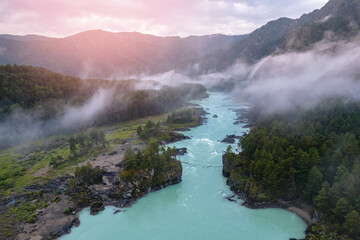 Evening landscape Altai mountains summer Russia, aerial top view. Blue Katun river with destroyed suspension bridge after flood, fog mood