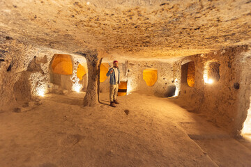 Derinkuyu or Kaymakli underground city ancient cave in Cappadocia, Turkey - obrazy, fototapety, plakaty
