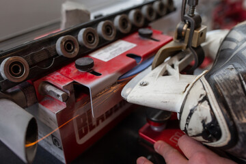 Hockey skate blade sharpening by professional equipment manager