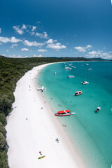 Aerial view of Whitehaven Beach with boats and a seaplane