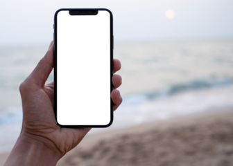 Hand holding black smartphone with transparent screen and beach see background , smartphone frameless application design concept and PNG file