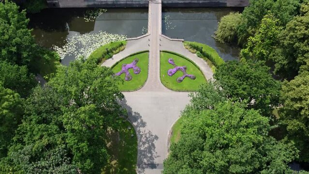 Aerial camera pan of Slot Zeist is a seventeenth-century castle in the Dutch that was built as a pleasure ground of Willem Adriaan van Nassau it is surrounded by an English landscape park 4k