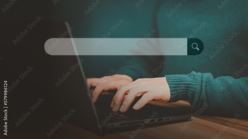 Poster Man hand working with laptop computer on table in his home. Search the Internet with an empty search bar. Best SEO search networking, Searching browsing internet data information concept.