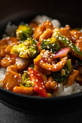 Bowl of asian cooked rice with beef and vegetables