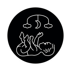 The baby lies and plays with a children's mobile black line icon. Toddler development.