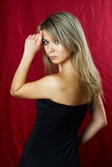 Fototapeta premium Young pretty woman in black dress