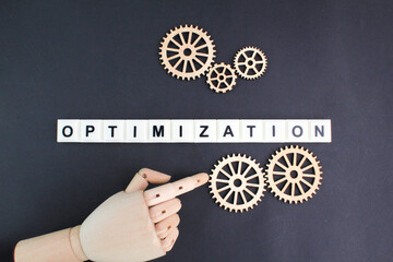 gear teeth with the word Optimization. technology concept and optimization