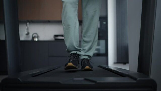 Man Walking On Treadmill At Home, Details View On Legs And Feet In Sportive Sneakers, Active Life