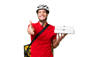 Pizza delivery man with work uniform picking up pizza boxes over isolated background shaking hands for closing a good deal