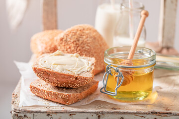 Healthy buns with honey for breakfast in farm.