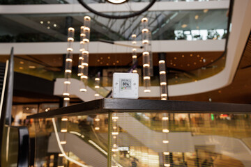 CO₂ sensor monitor. Indoor air quality sensor. Healthy work environment. Shopping mall proper...