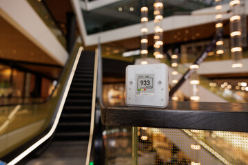 CO₂ sensor monitor. Indoor air quality sensor. Healthy work environment. Shopping mall proper ventilation in your levels airflow in the room. Carbon dioxide levels and airflow. Smart home
