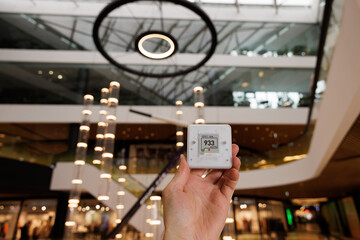 CO₂ sensor monitor. Indoor air quality sensor. Healthy work environment. Shopping mall proper...